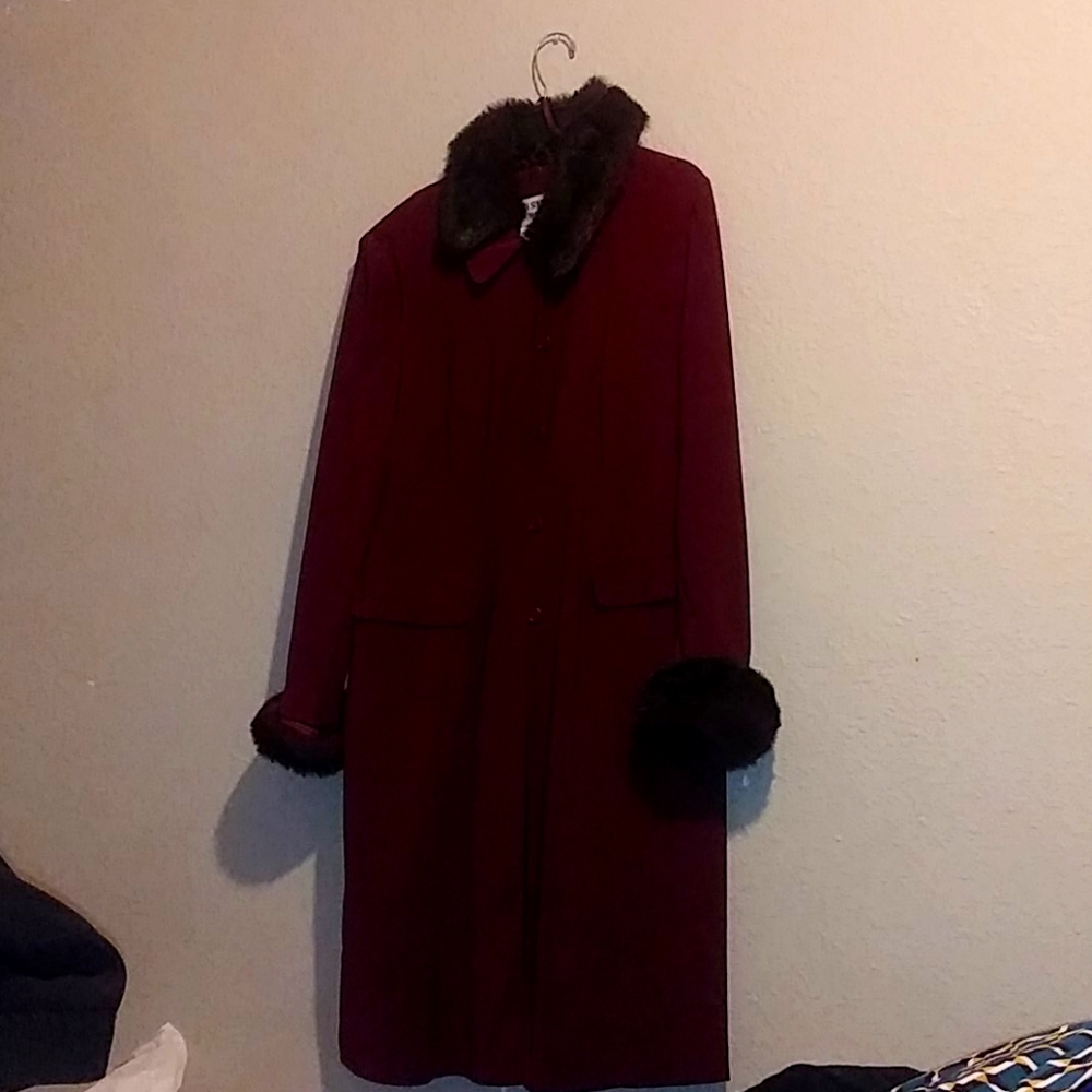 A rich burgundy fancy styled coat with dress.